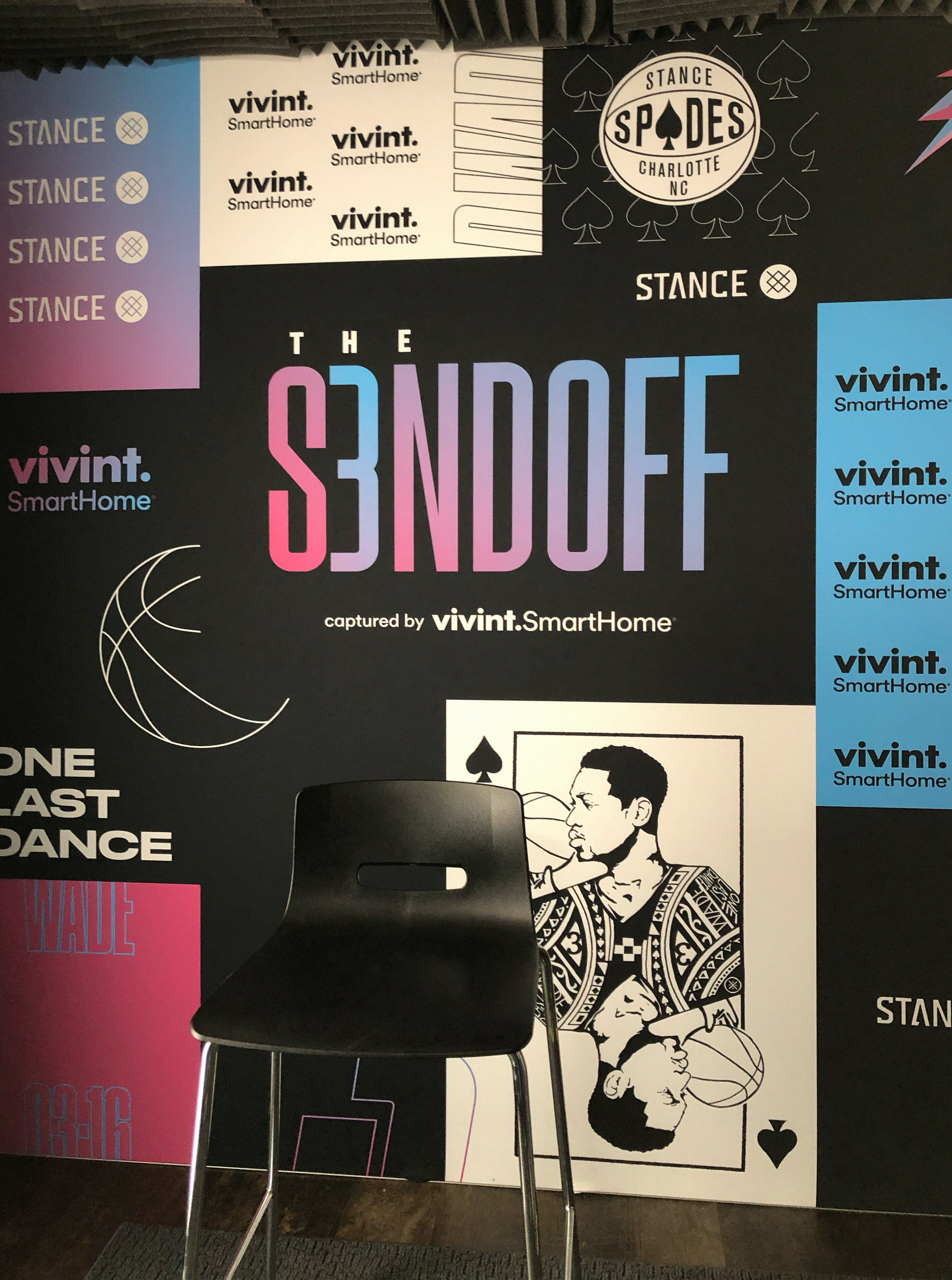 Step-and-repeat wall with S3NDOFF, Stance and Vivint logos and a Dwyane Wade playing-card illustration
